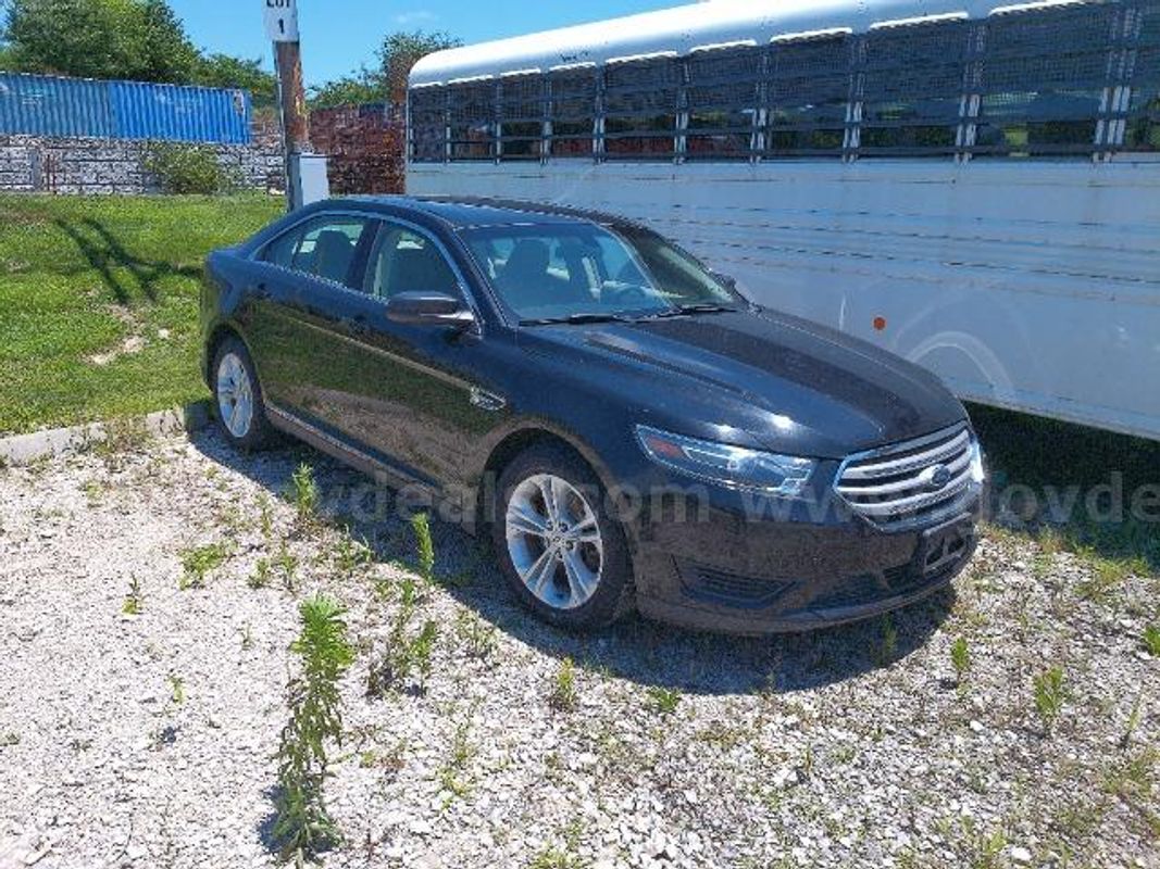 2015 Ford Taurus; (121,539 Miles).