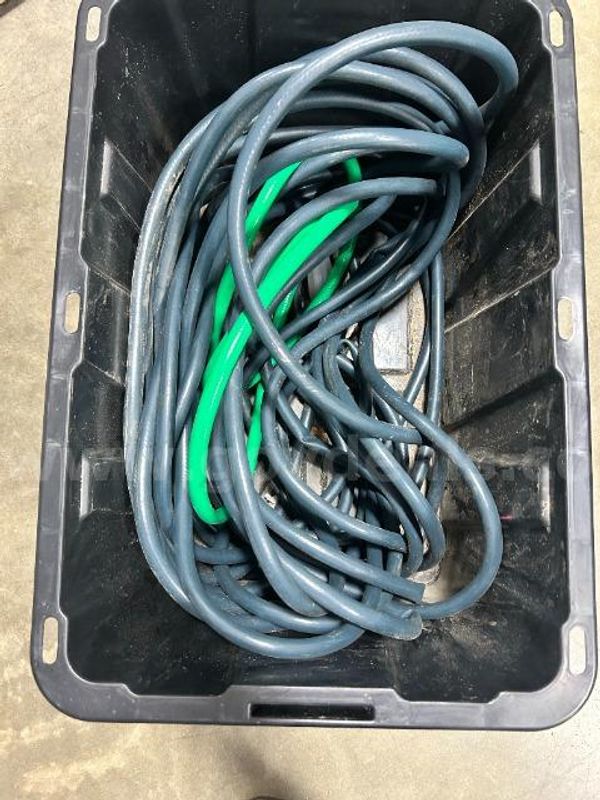 Lot of water hoses, sprayer, and chemicals.