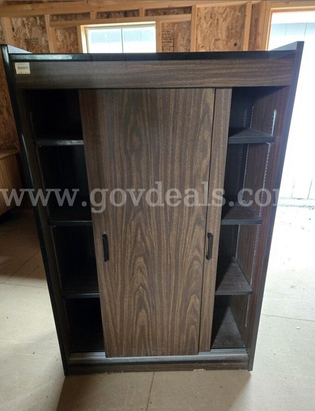 (1) Bookshelf, 56'' H X 34” W x 12” D with sliding doors, good condition.