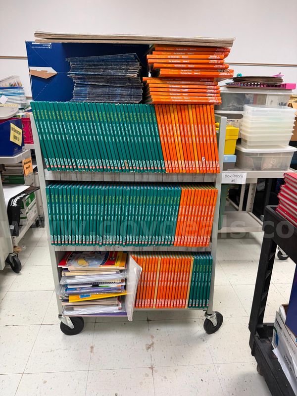 1 lot of various textbooks, projector screens, and bookends