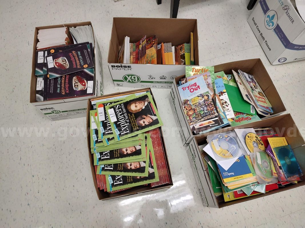 Student desks, office chair, ReadyGen books