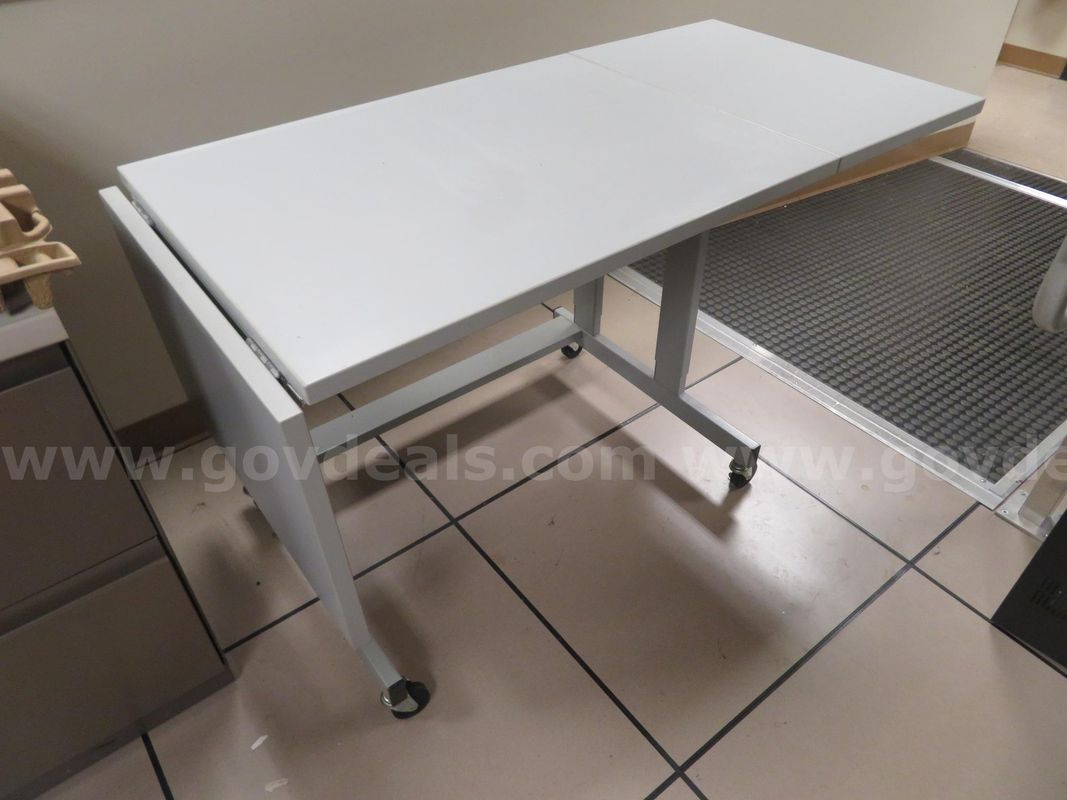Drop-leaf gray table on casters