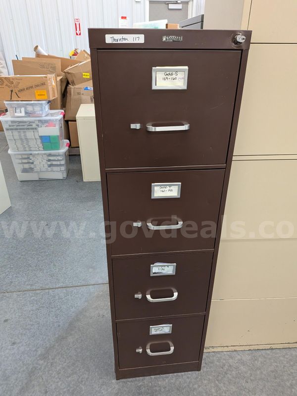Brown colored 4 drawer filing cabinet