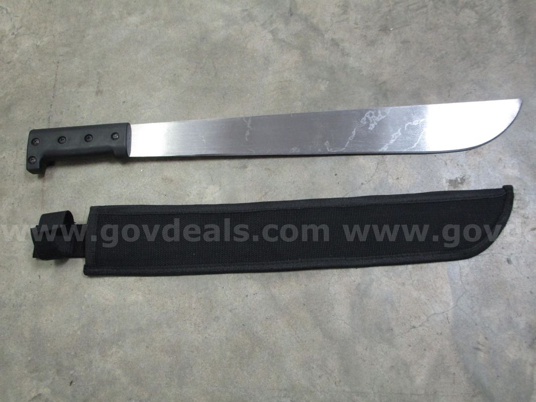 (1) USED MACHETE IN BLACK SHEATH
