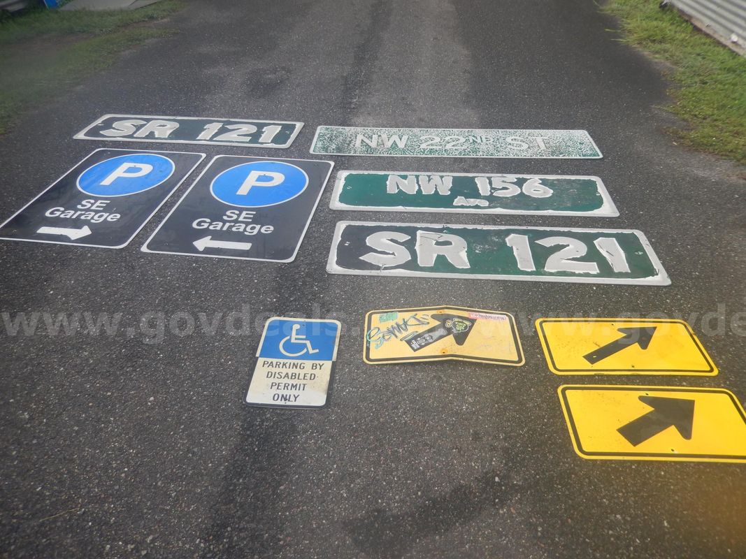 USED (2) SE GARAGE PARKING SIGNS, (4) STREET SIGNS, (3) ARROW SIGNS, (1) HANDICAP PARKING SIGN