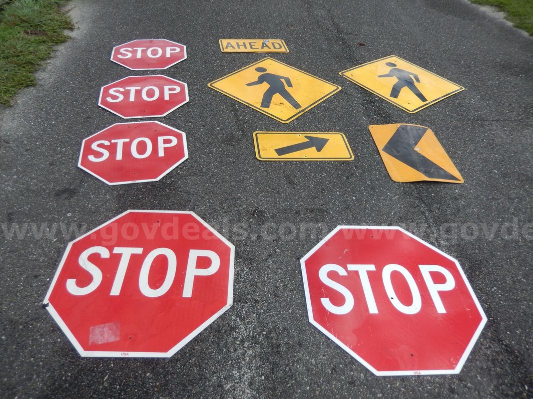 USED (5) STOP SIGNS, (2) PEDESTRIAN SIGNS, (1) ROAD SIGN, (1) ARROW SIGN, (1) AHEAD SIGN