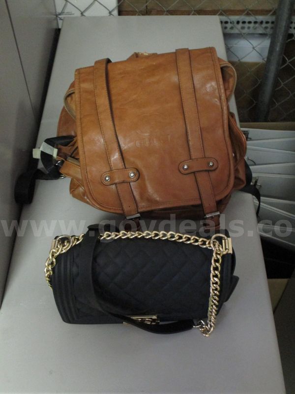 (1) Used Designer Brown Backpack; (1) Used Designer Black Handbag