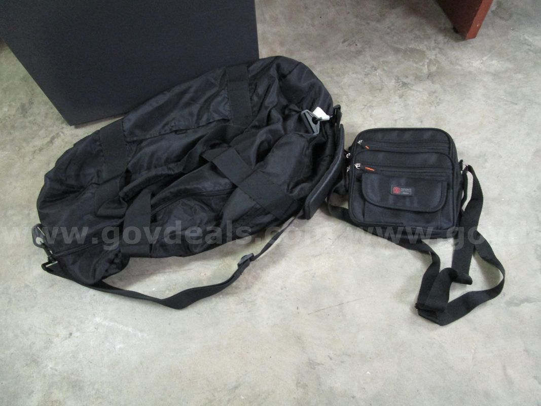 (1) USED BLACK DUFFLE BAG; (1) USED BLACK SLING BAG