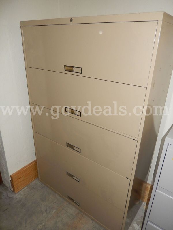 USED (1) TAN METAL, 5-LATCH DOOR, LATERAL 65" H x 18" W x 42" L