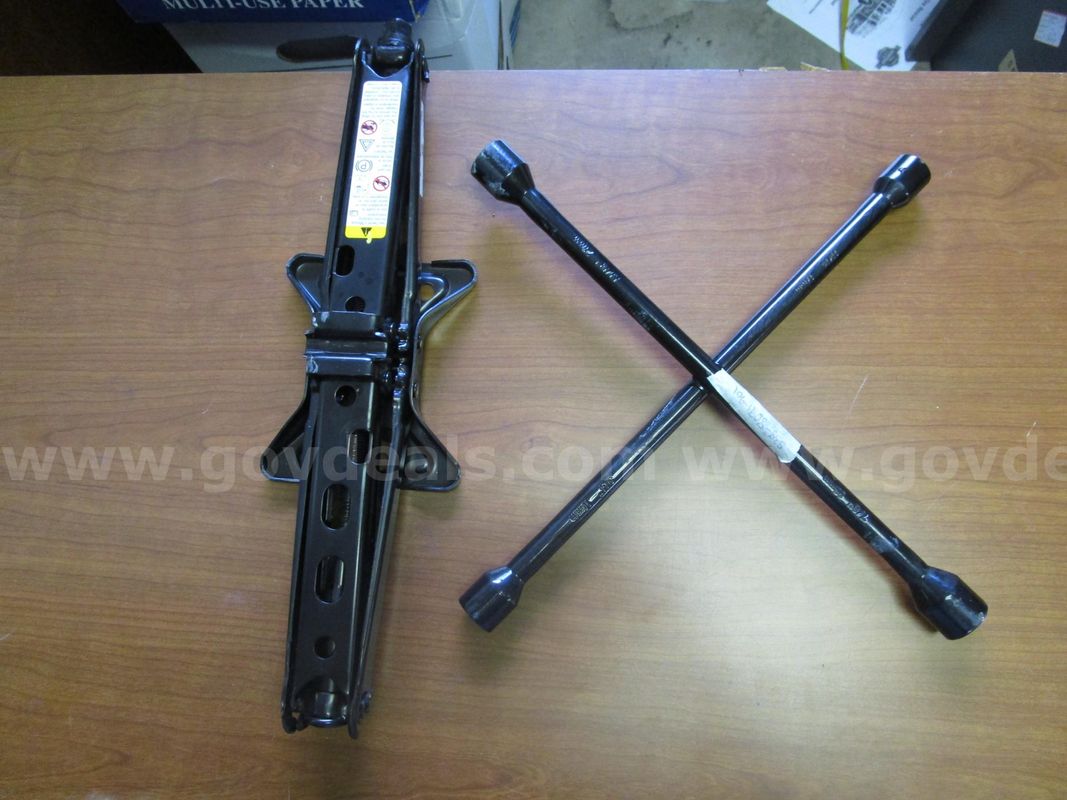 (1) USED CAR JACK; (1) USED CROSS LUG WRENCH