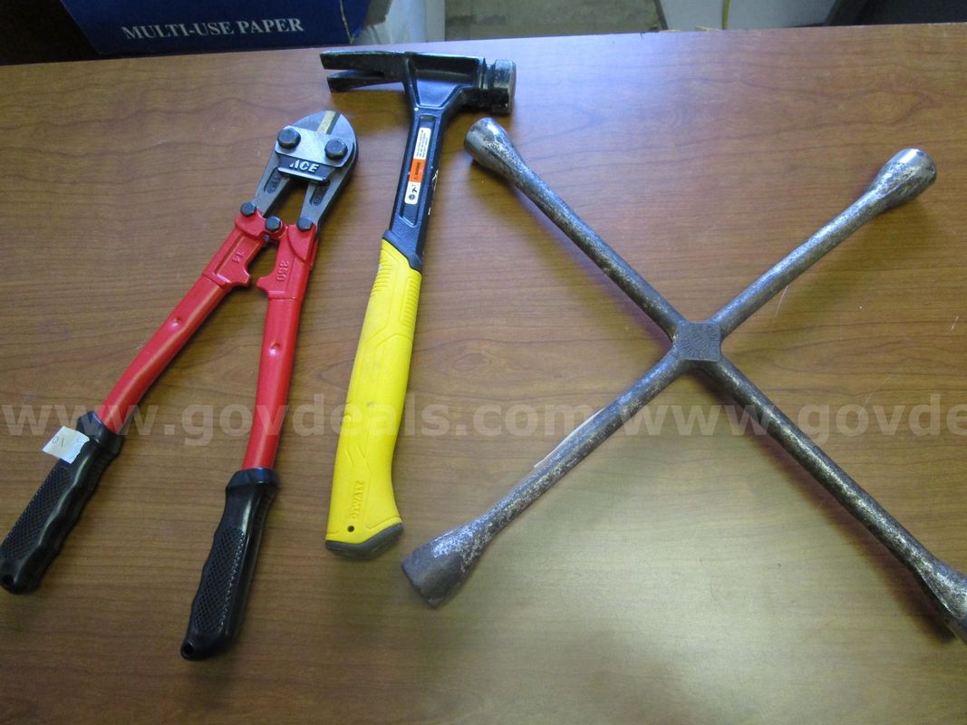 (1) USED HAMMER; (1) USED CROSS LUG WRENCH; (1) USED BOLTCUTTER