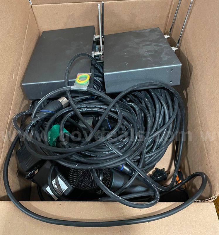 Lot of transmitters, receivers, cables, and microphones