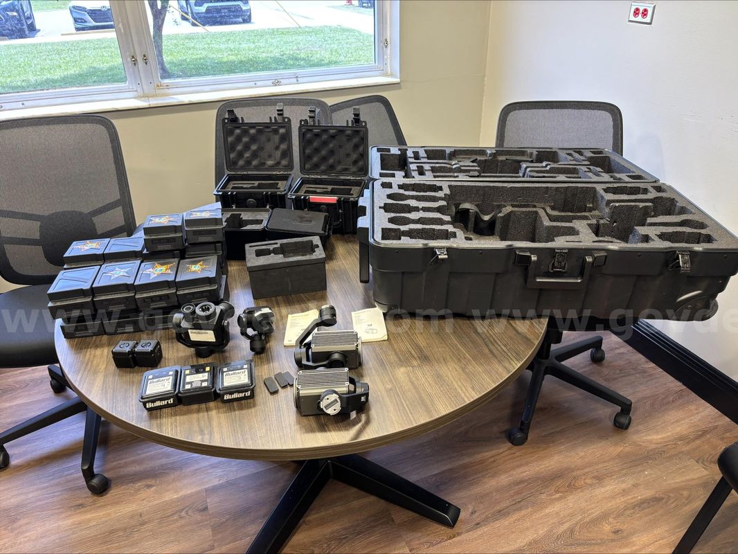 Assorted batteries,cases and camera attachments for an M200 SERIES DJI drone