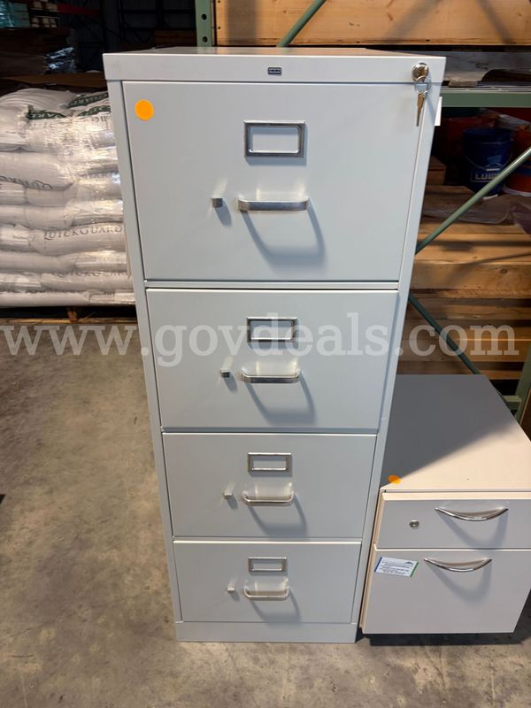 (1) 4 Drawer File Cabinet with keys - 1 smaller cabinet