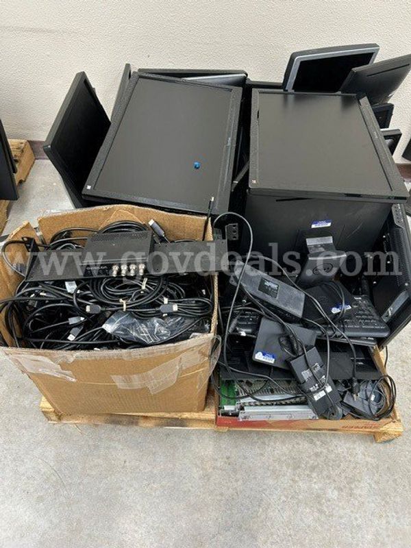 20 Monitors, HDMI and DVI cords, and several docking stations