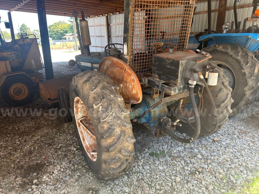 3000 for tractor with a yellow sweeper attached