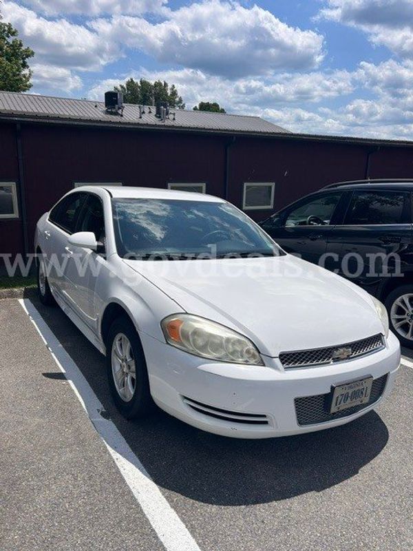 White four door Chevrolet Impala