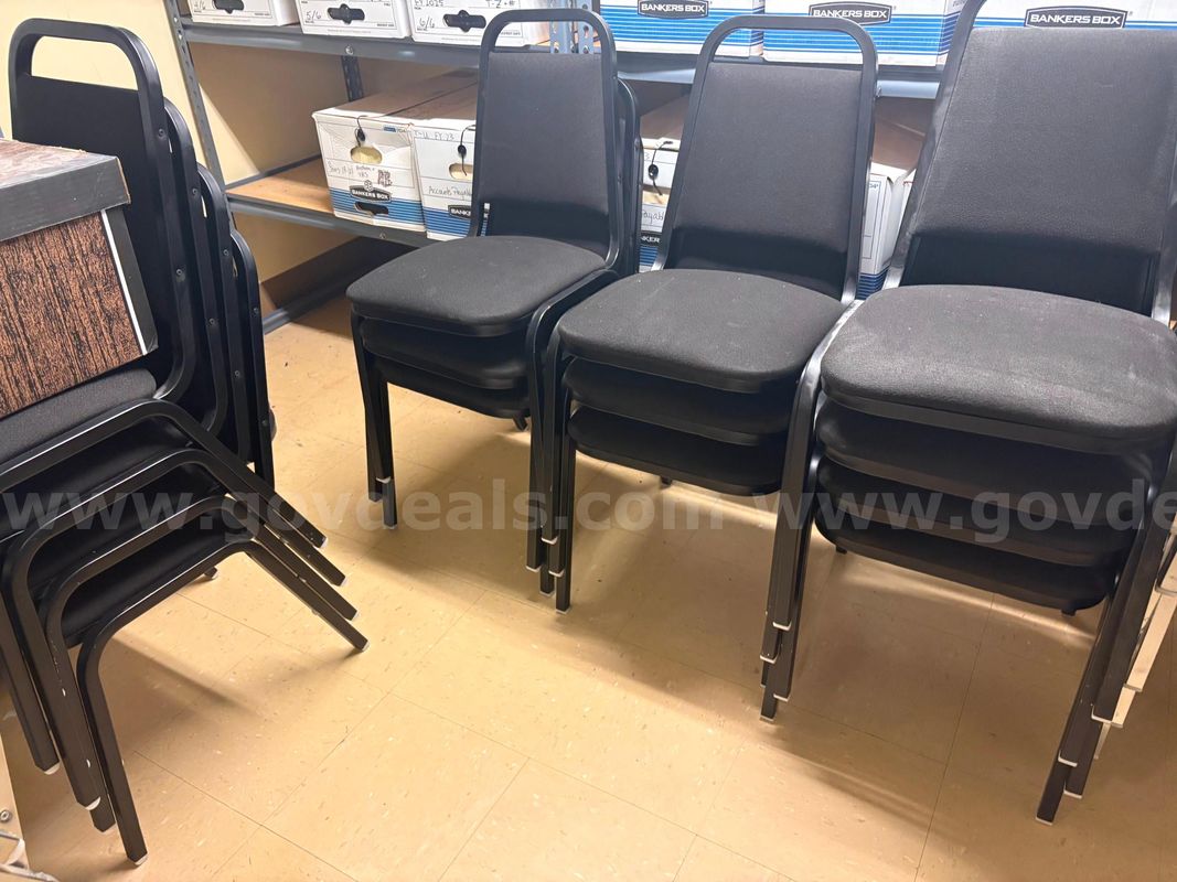 14 stacking banquet/conference chairs—Black upholstered metal-frame stacking chairs