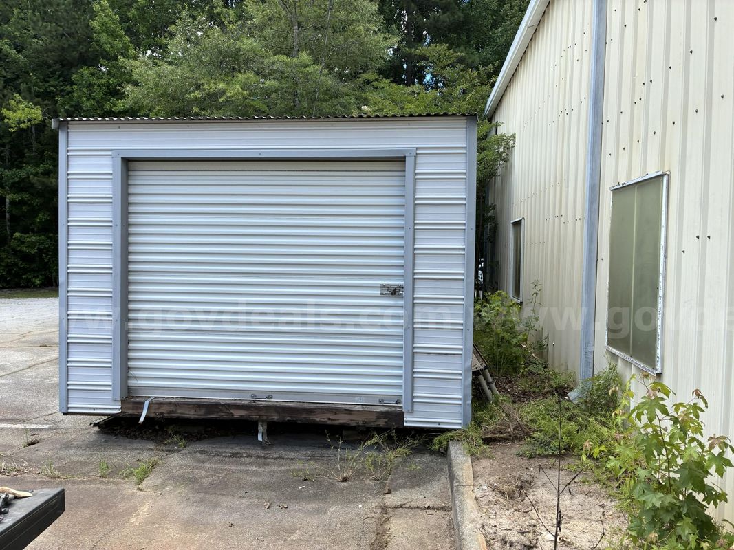 1-USED 12’x28’ Storage Building with Rollup Door – Contents NOT Included (SOLD AS IS).