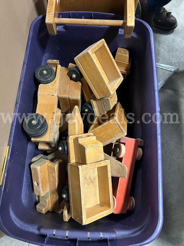 Wooden trucks, small wooden street signs.