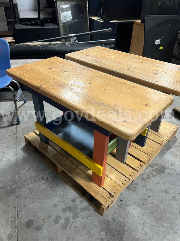 Two wooden activity tables used in our preschool.