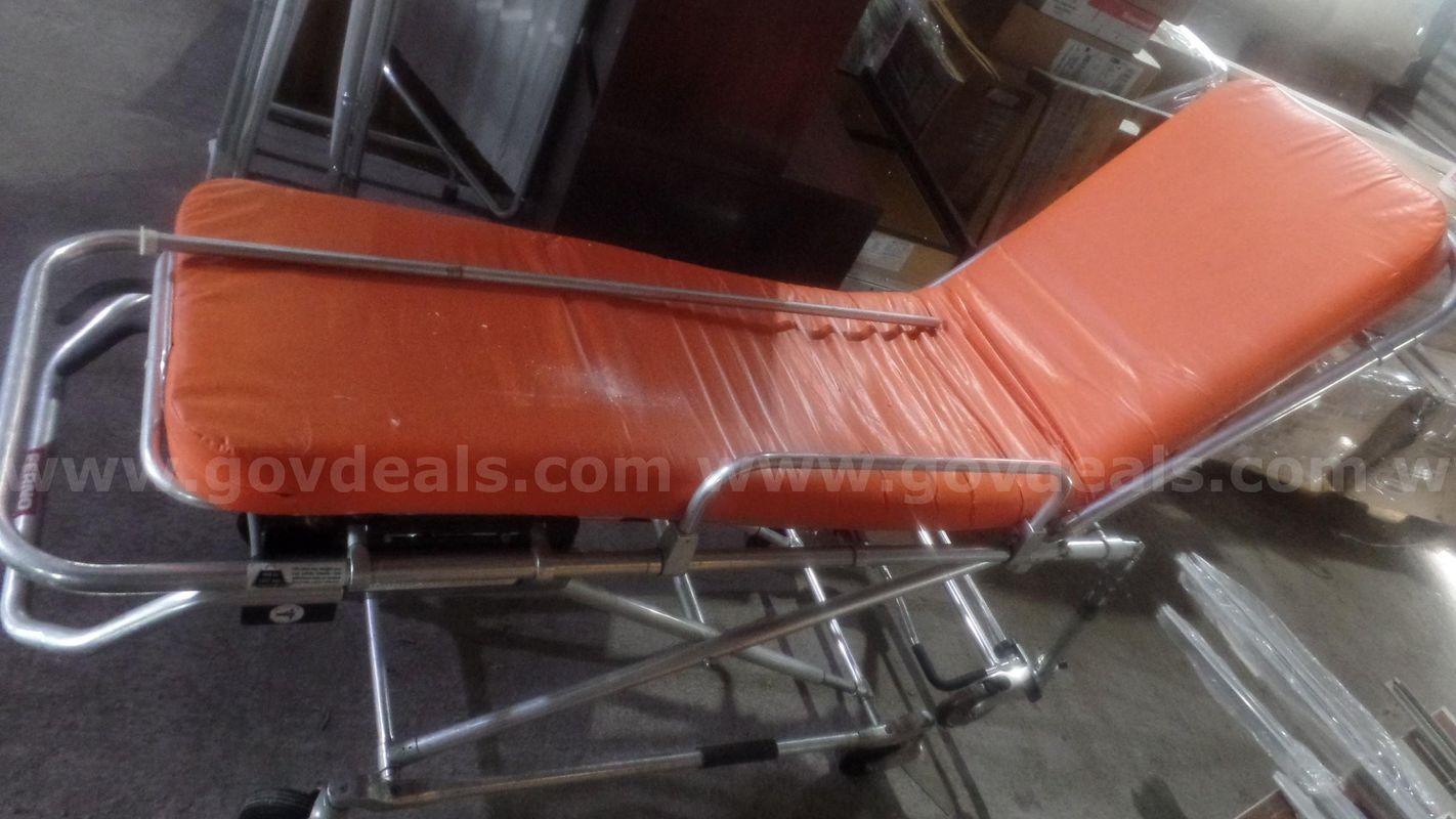 Examining Table, Mannequin, orange bed, curtains