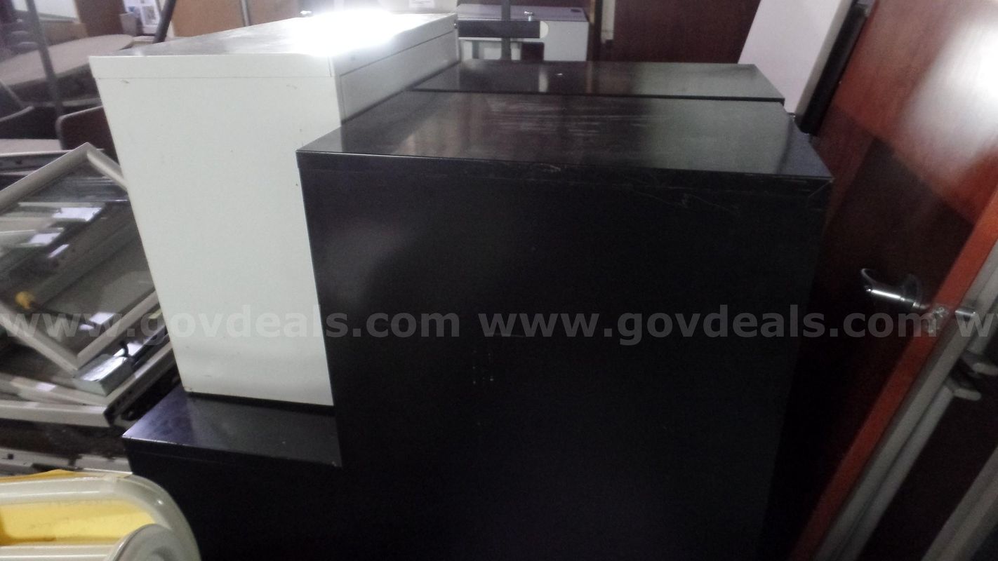 3 black and 1 white filing cabinet