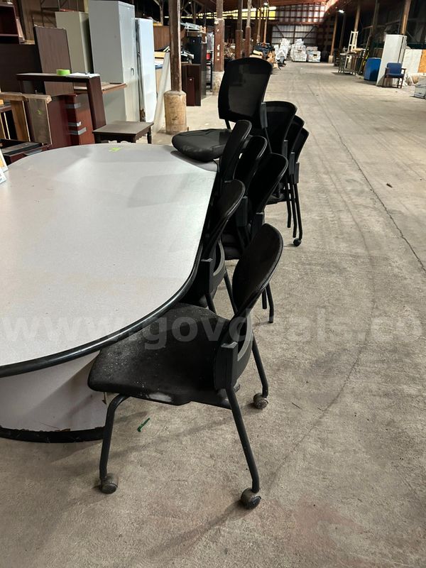 1 large table, 9 chairs, 4 cork boards