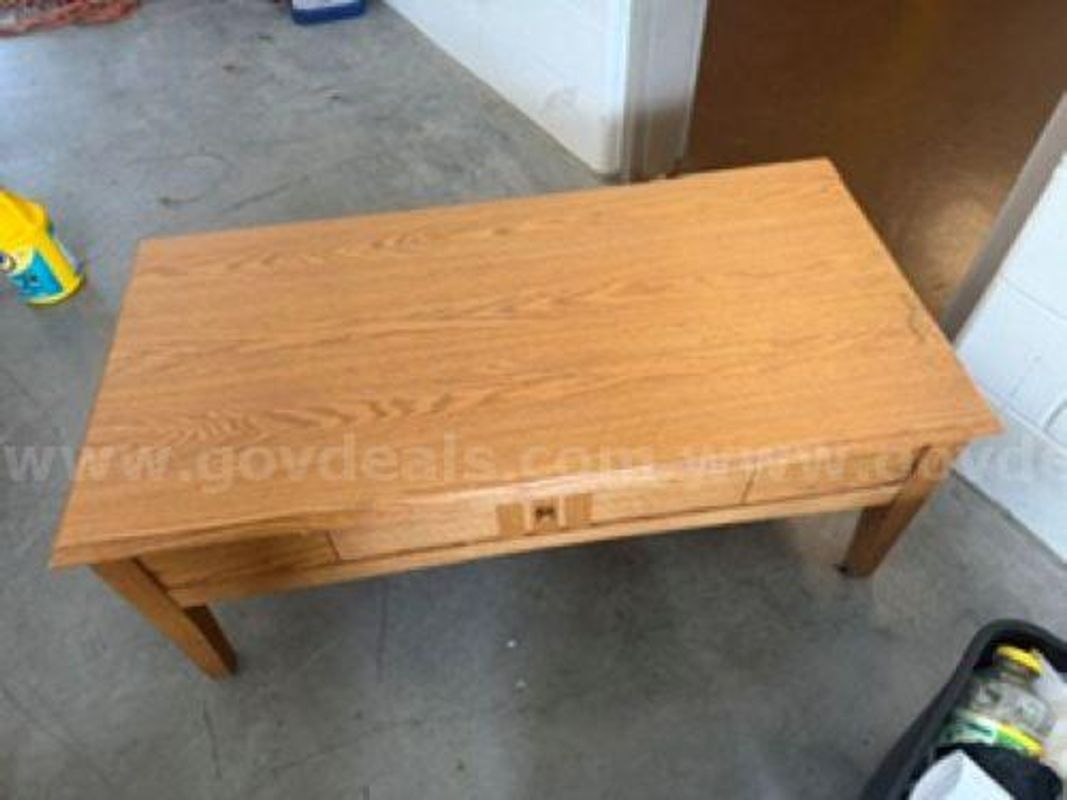 Coffee table, two end tables and a cabinet