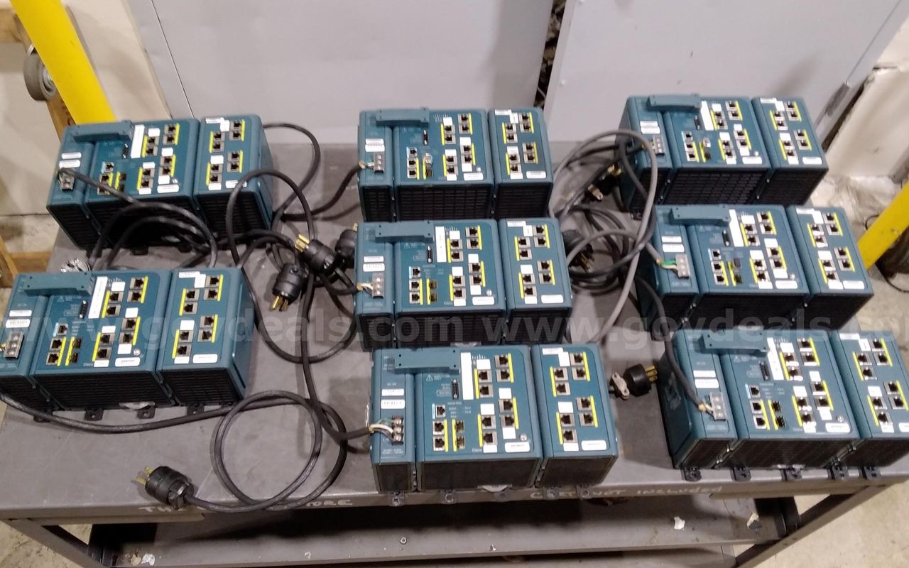 Lot of (8) Cisco IE-3000-8TC industrial Ethernet Switches with plugs.