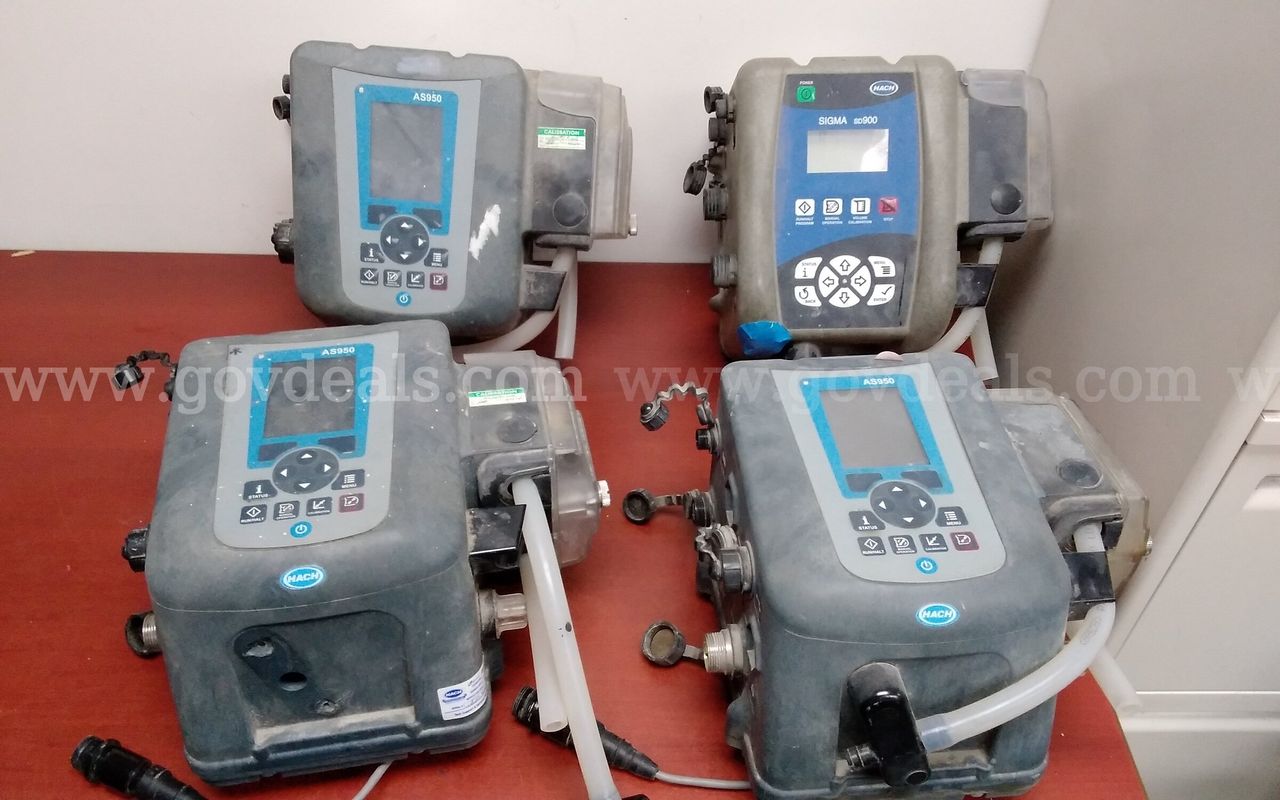 Lot of (4) HACH water samplers controllers.