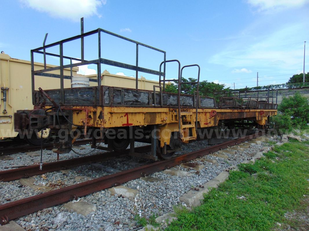 Lot of (2) Plasser America 40-foot flat rail carts. The items are being sold as scrap. DTPW 26-12 #1
