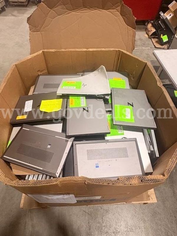 Damaged Laptops with Hard drive in various states of disrepair
