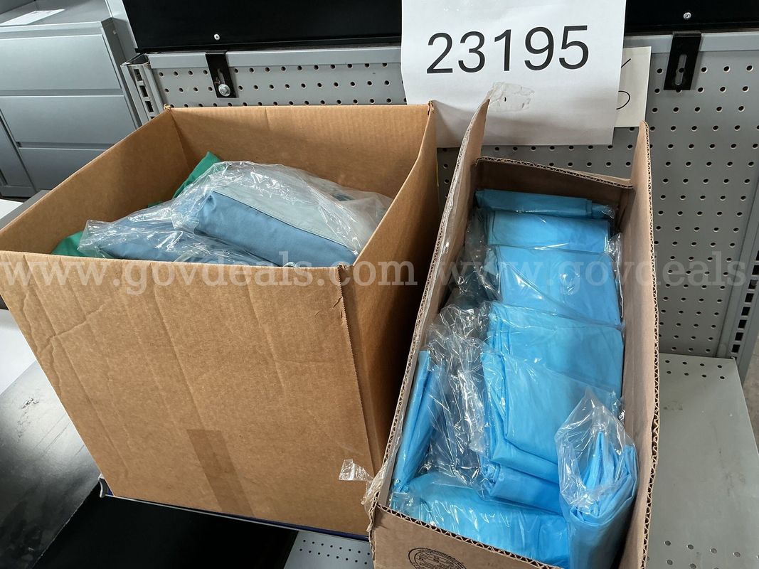 Box of Scrubs and a Box of Plastic Gowns.