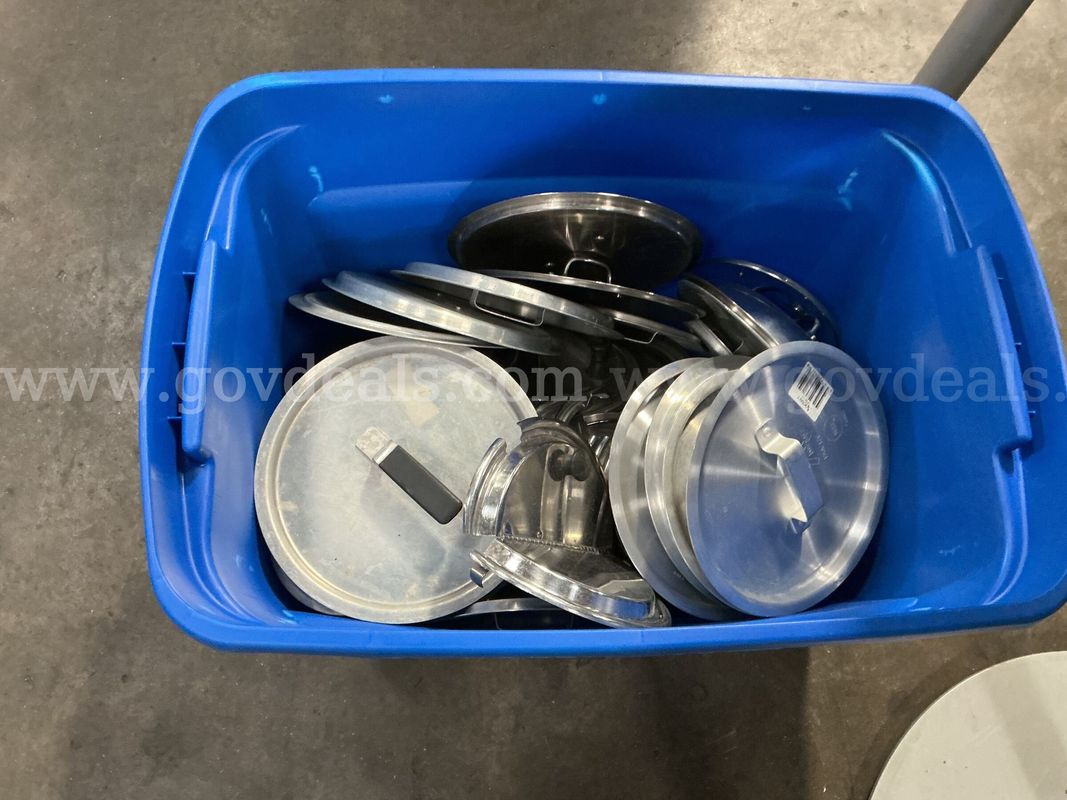 Tote Containing Various Sized Pot and Pan Lids.