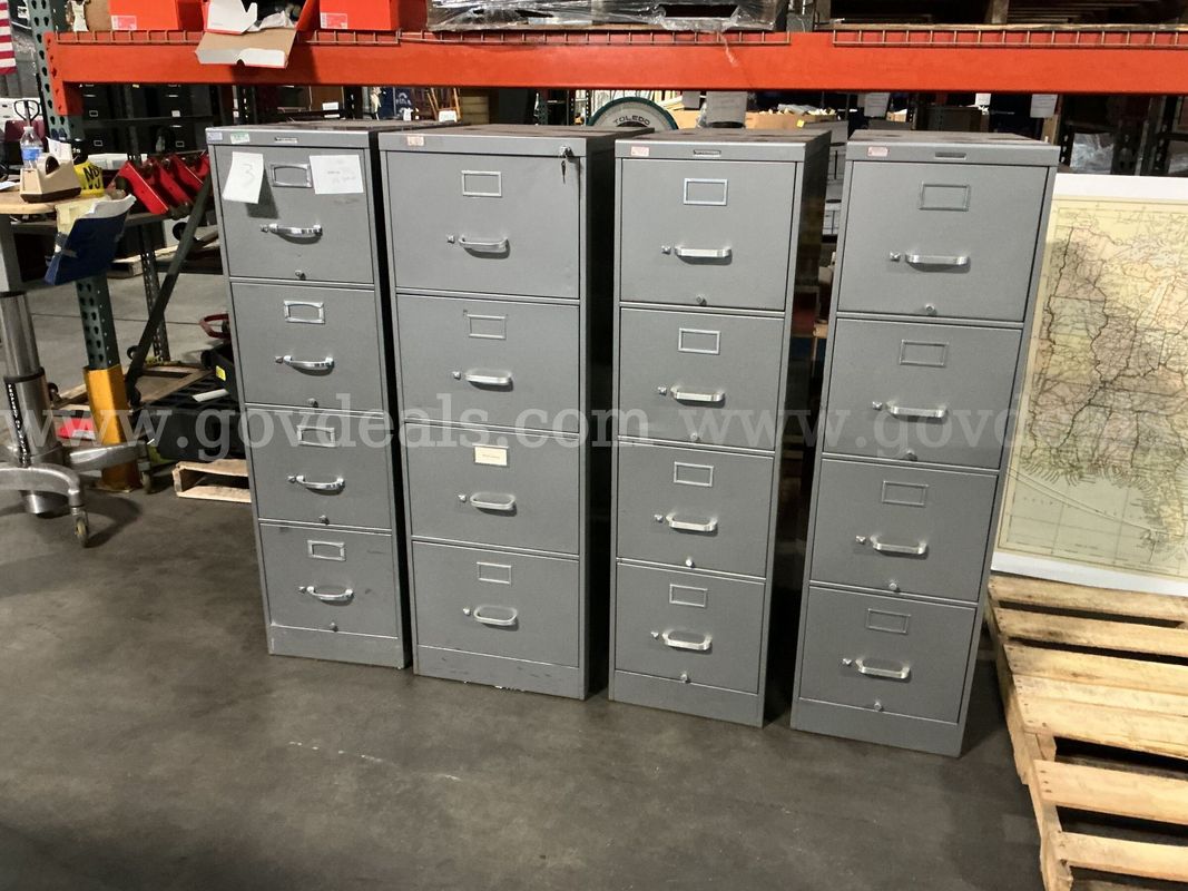 4 - 4 Drawer Filing Cabinets.