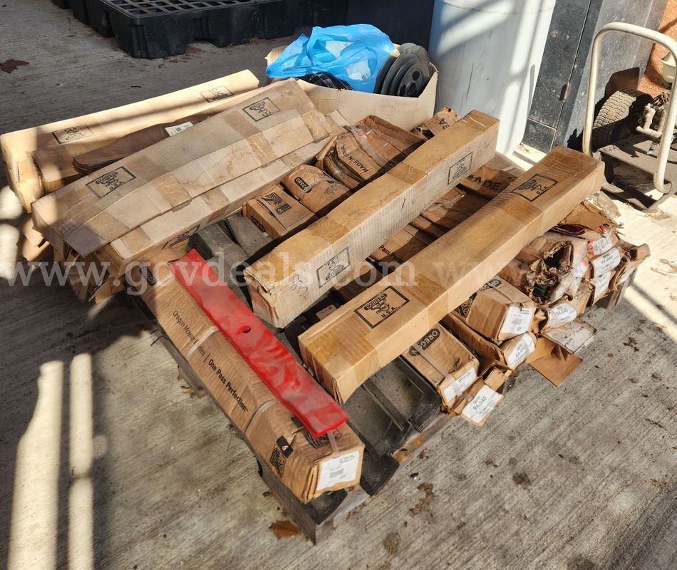 Pallet of NOS Mower Blades, Pulleys, and Belts