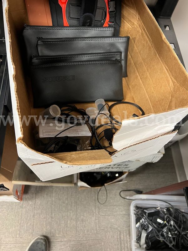 A box of microphones and Bags