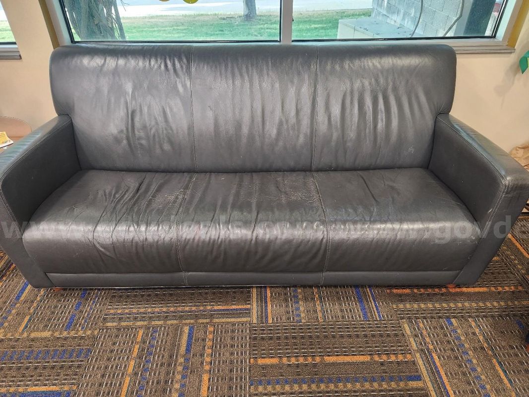 vinyl couch. Vinyl has small cracks and wear