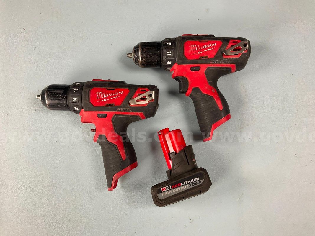 2 - Milwaukee Cordless Drill/Drivers Model 2407-20 and 1 - 5ah Battery, All Power On (1 - Damaged Trigger)