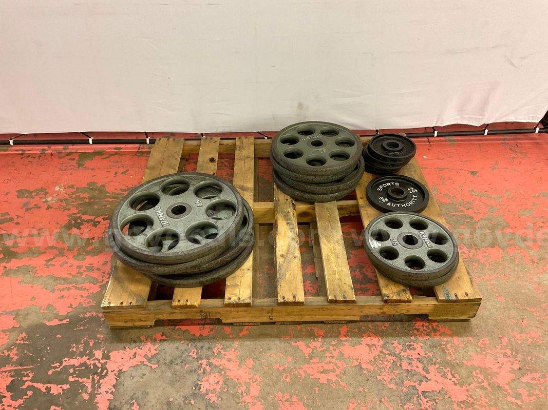 Pallet of Weight Plates: 2 - 25lbs, 1 - 10lbs, 4 - 35lbs, 5 - 5lbs & 4 - 45lbs