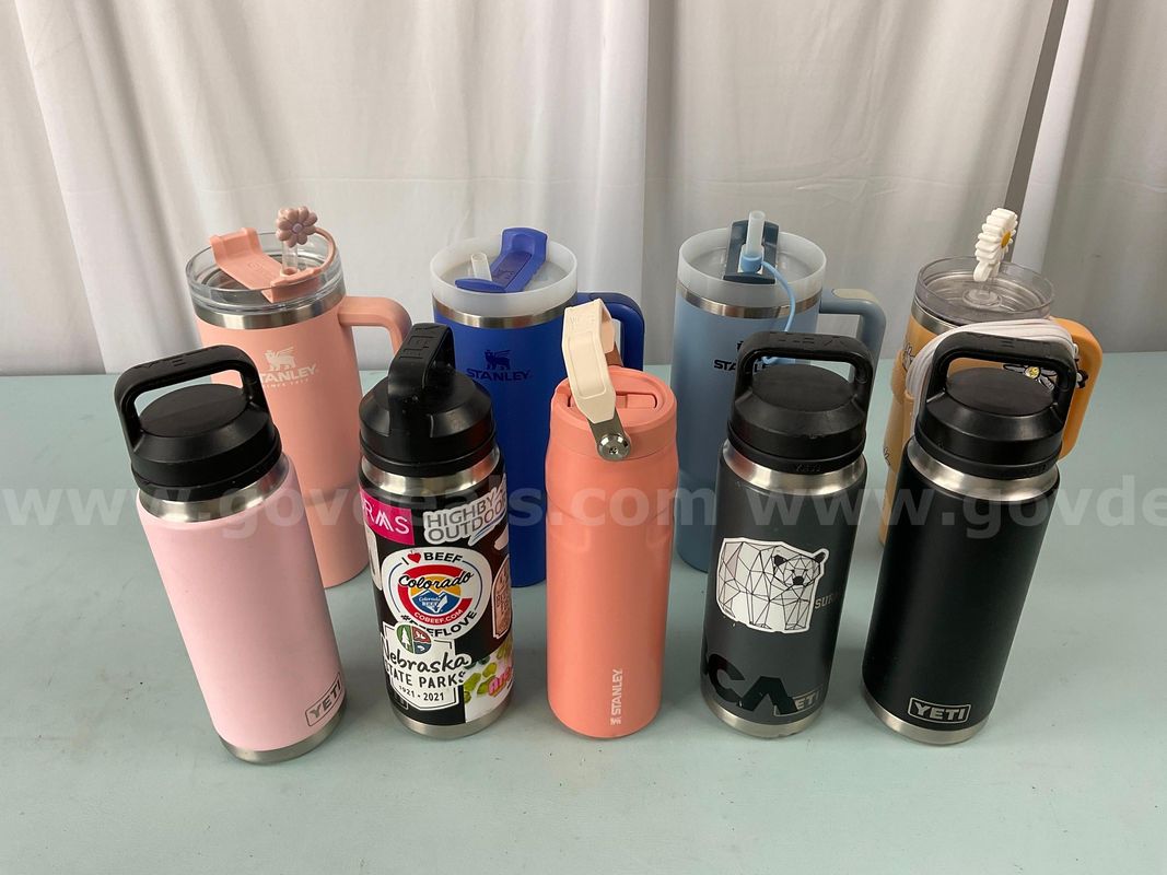 9 - Water Bottles: Labeled as 4 - Stanley, 4 - YETI & Disney With Wallet