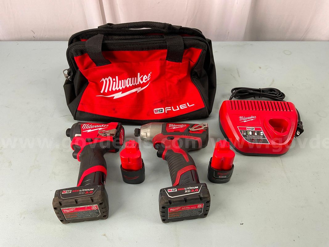2 - Milwaukee Cordless Drills With 4 - Batteries, Battery Charger & Tool Bag