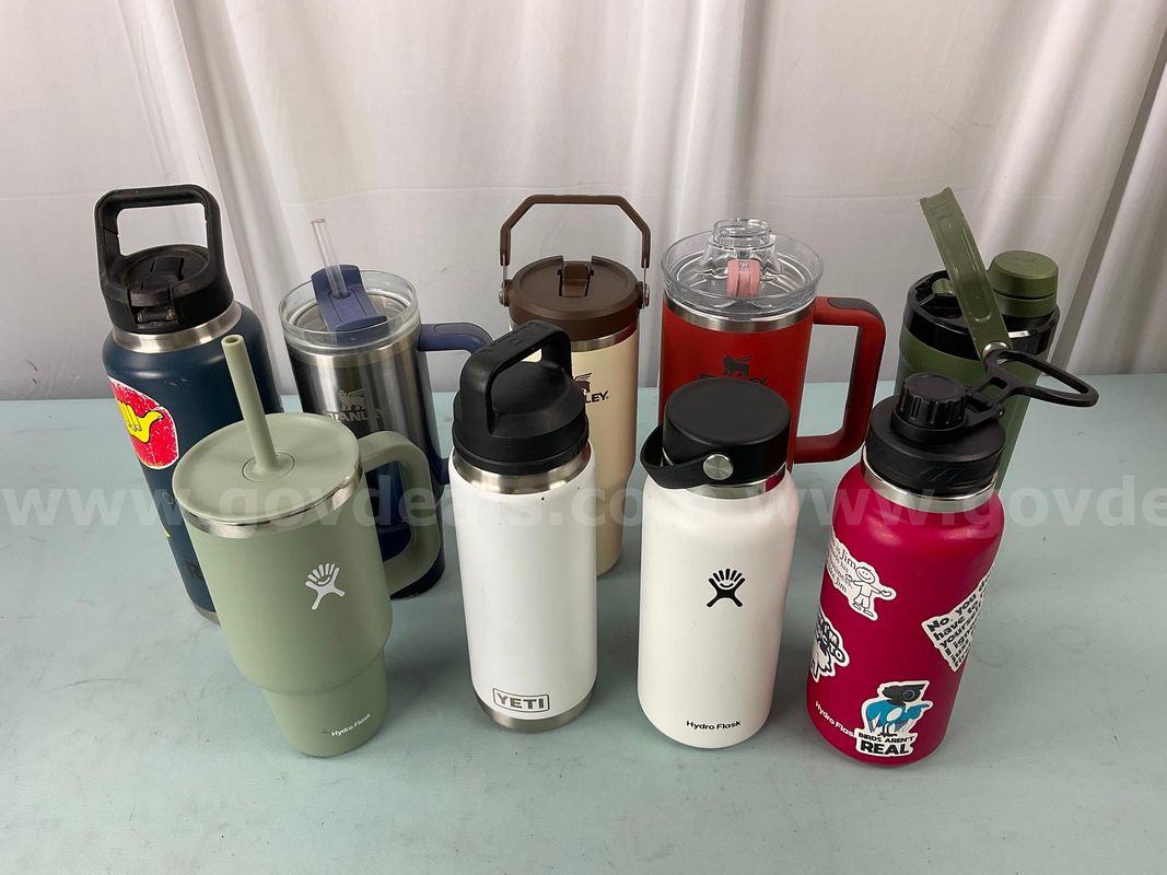 9 - Water Bottles, Labeled as 4 - Stanley, 3 - Hydro Flask & 2 - YETI