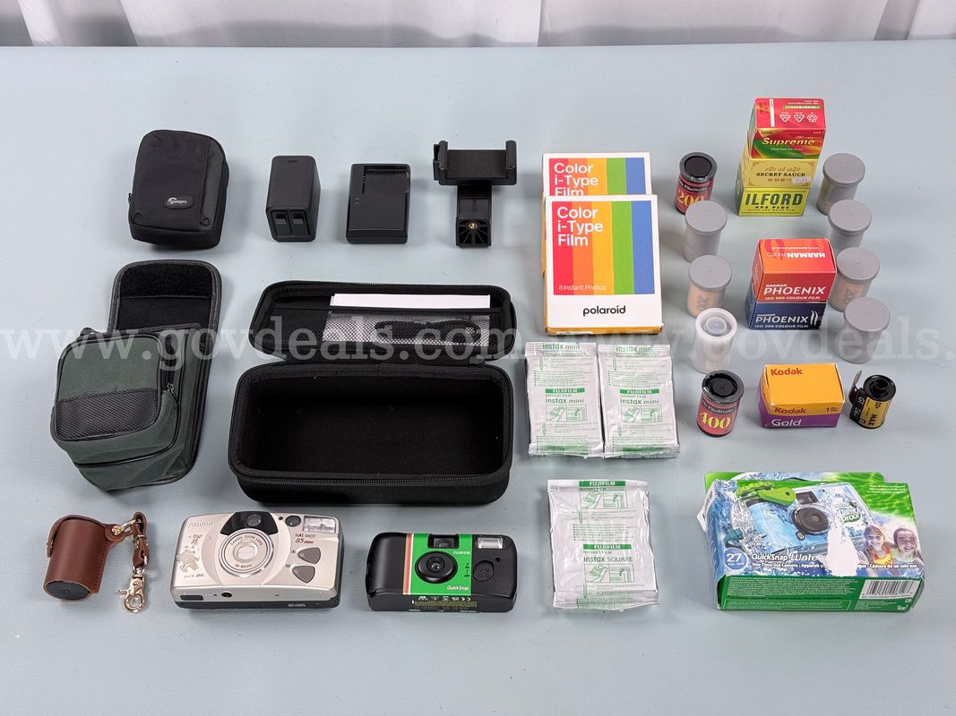Lot of Misc. Cameras, Camera Equipment, Film, and Accessories Including Canon, GoPro, Polaroid, and More (Untested)