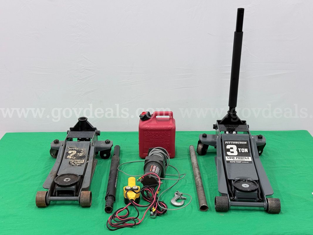 Lot of Vehicle Equipment Including Floor Jacks, Wench, and Gas Can