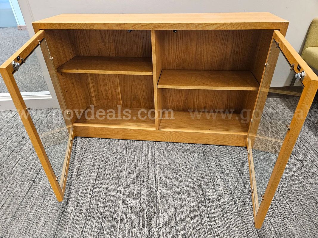 Wooden Cabinet with bifold doors. Glass windows on doors