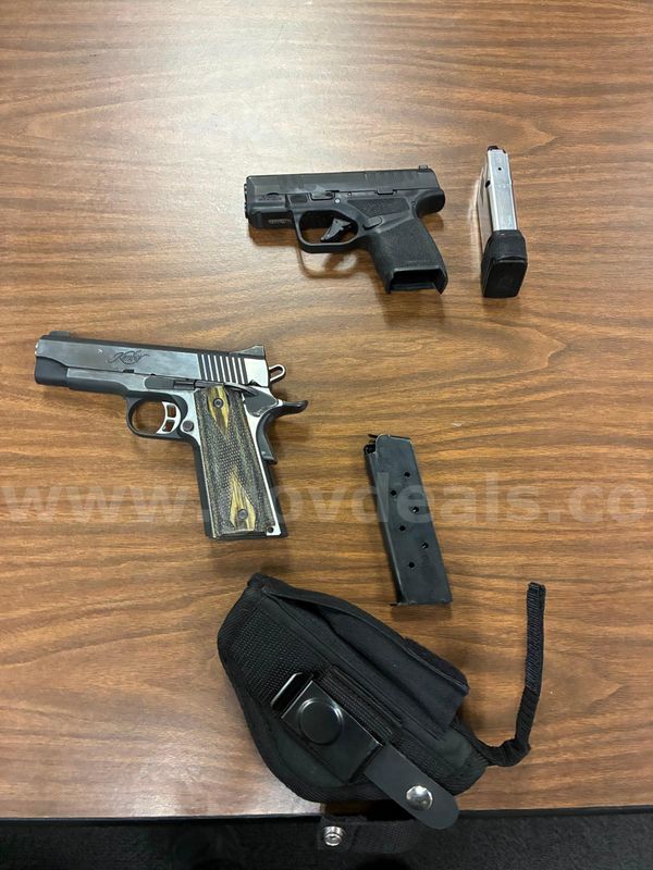 2 Pistols Kimber and Springfield Armory Hell Cat Confiscated Firearms.