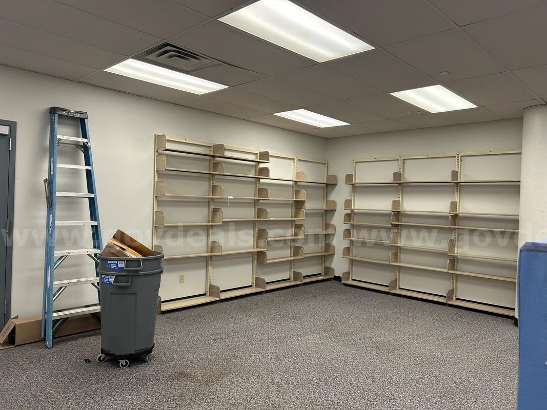 7 sections of metal one-sided library shelving