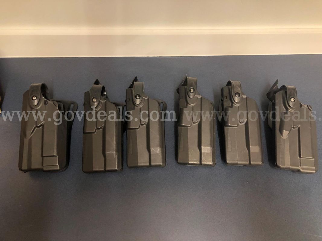 Six lefthand Safariland pistol holsters